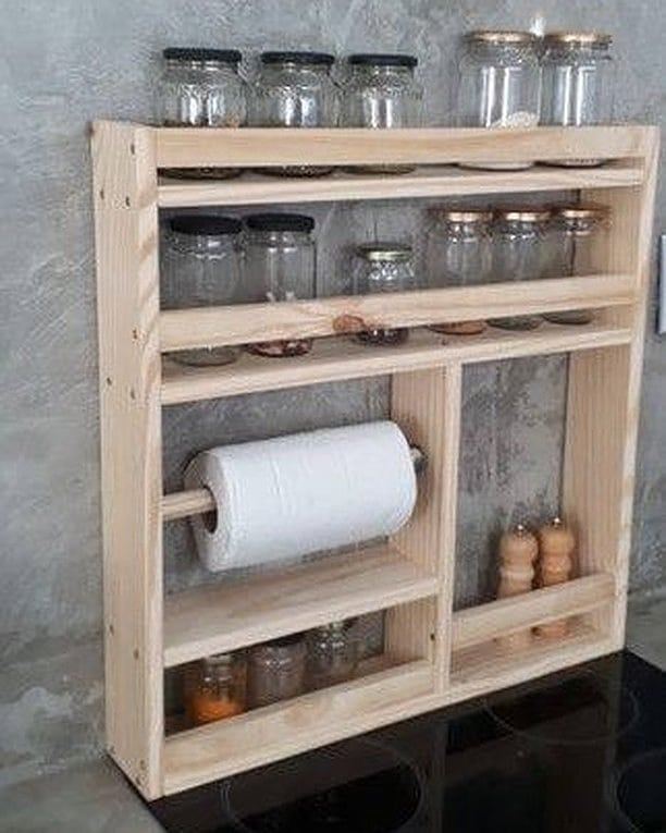 Wall-mounted timber storage rack with jars and a paper-towel holder